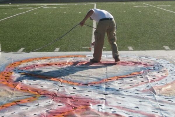 incorporating custom logo stencils into athletic field design