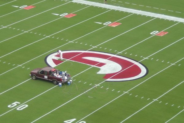 Truck Painting a Logo on a Football Field